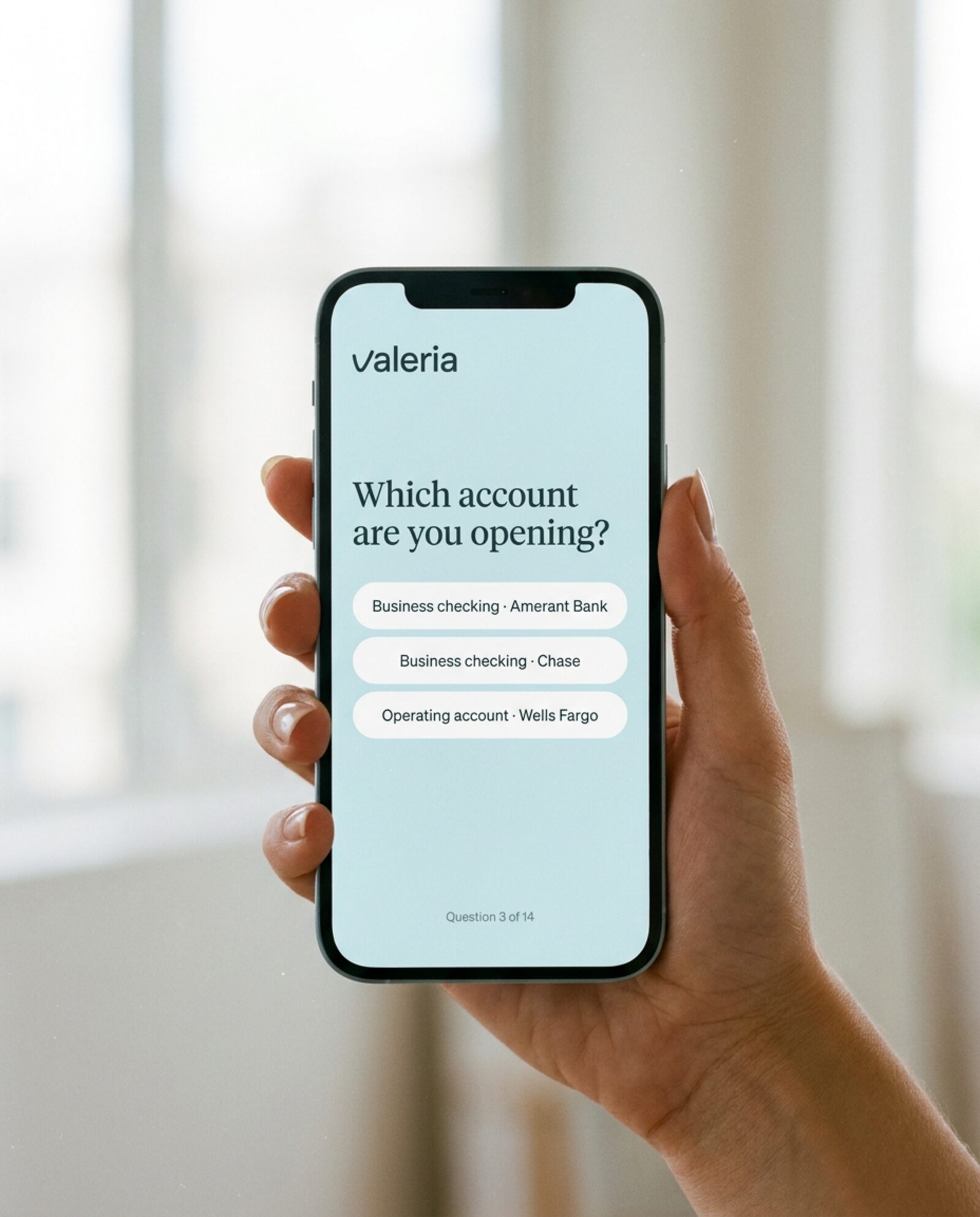 A hand holding a phone with the VALERIA form open on question 3 of 14, which account are you opening